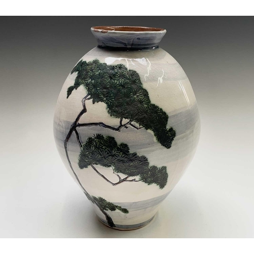 807 - Alan Brough, A studio pottery vase, incised and painted with a pine tree and a fruiting tree, on a b... 