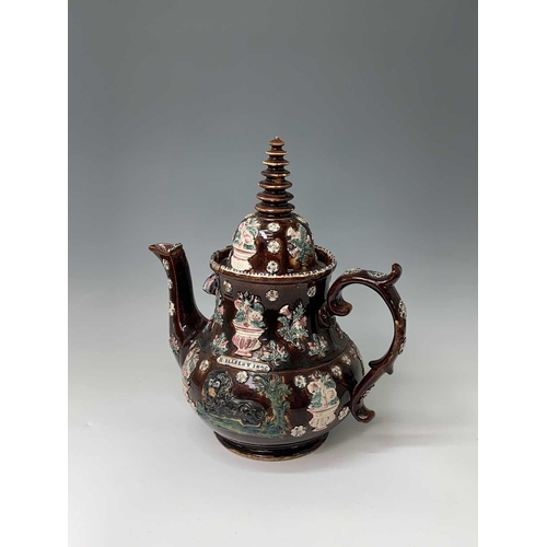 815 - A Measham treacle glazed barge ware teapot, dated 1876, of large proportions, the domed cover with '... 