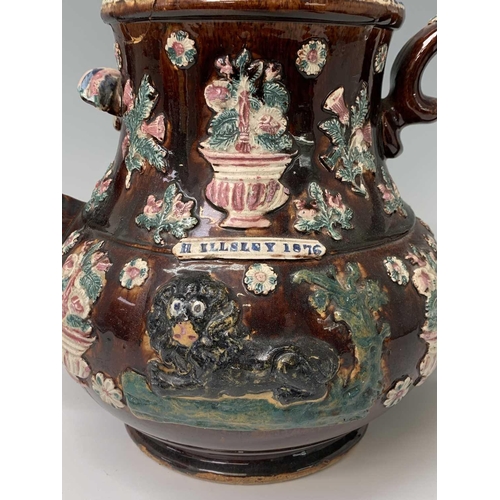 815 - A Measham treacle glazed barge ware teapot, dated 1876, of large proportions, the domed cover with '... 