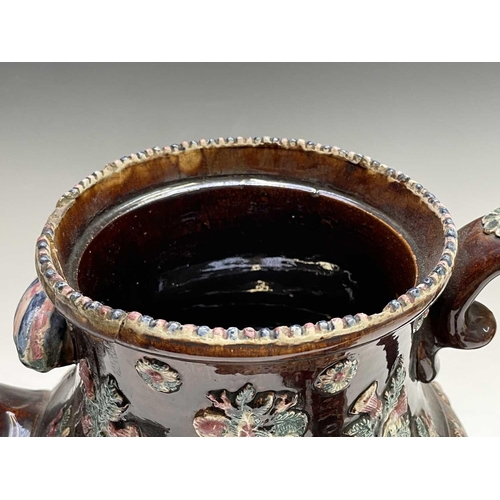 815 - A Measham treacle glazed barge ware teapot, dated 1876, of large proportions, the domed cover with '... 