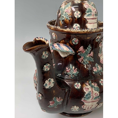 815 - A Measham treacle glazed barge ware teapot, dated 1876, of large proportions, the domed cover with '... 