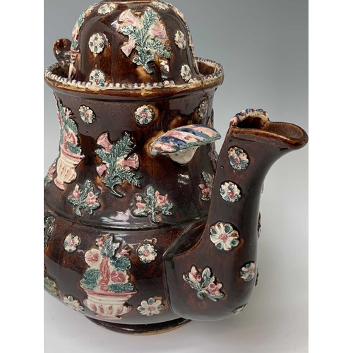 815 - A Measham treacle glazed barge ware teapot, dated 1876, of large proportions, the domed cover with '... 