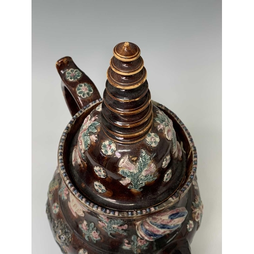 815 - A Measham treacle glazed barge ware teapot, dated 1876, of large proportions, the domed cover with '... 