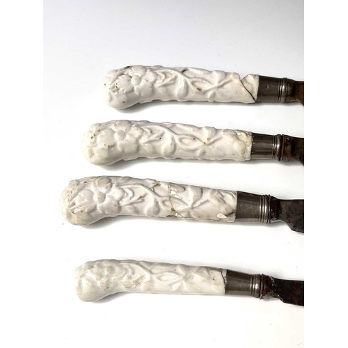 816 - Three Chelsea prunus moulded blanc de chine pistol grip knives, length 28cm, together with one other... 