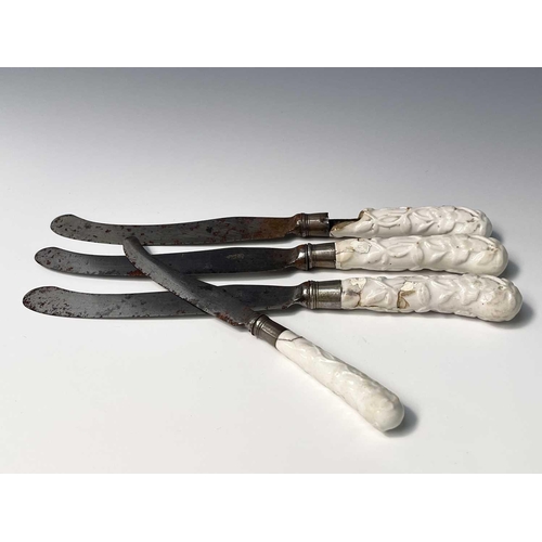 816 - Three Chelsea prunus moulded blanc de chine pistol grip knives, length 28cm, together with one other... 