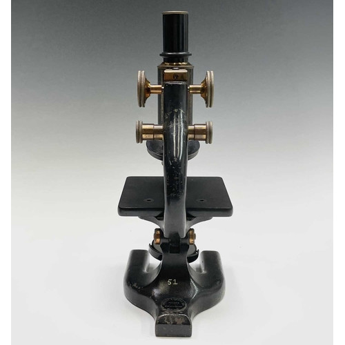 82 - A black lacquered and brass microscope, by Spencer, Buffalo, height 28cm, in stained pine case.