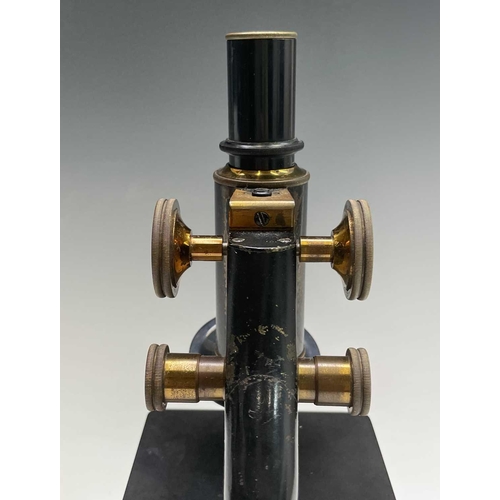 82 - A black lacquered and brass microscope, by Spencer, Buffalo, height 28cm, in stained pine case.