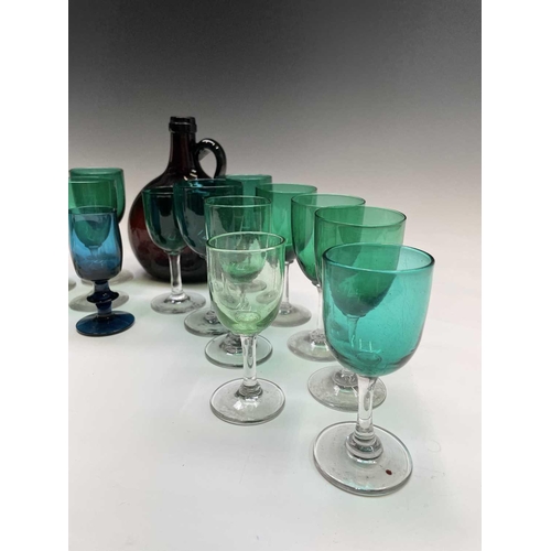 820 - An assortment of Victorian and later wine glasses with green and blue coloured bowls, together with ... 