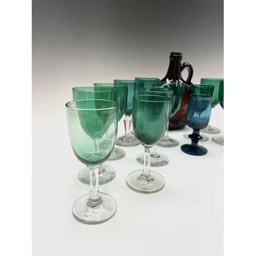 820 - An assortment of Victorian and later wine glasses with green and blue coloured bowls, together with ... 