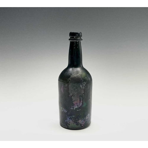 824 - A 19th century green glass bottle. Height 21cm