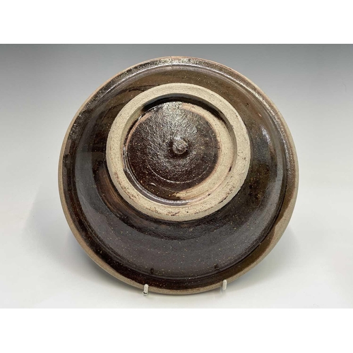 830 - A studio pottery plate with central unglazed band heightened in black, impressed seal mark, diameter... 