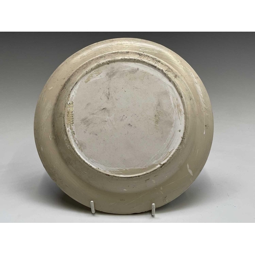 832 - A studio pottery unglazed plate, painted with a geometric floral design, the back indistinctly signe... 