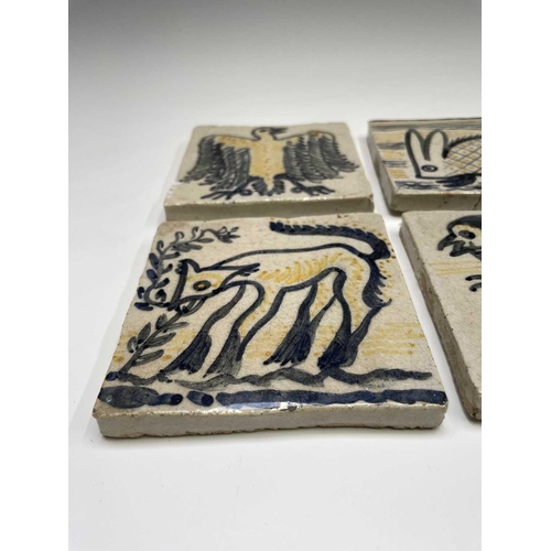 841 - A set of six studio pottery tiles, each hand painted with animal subjects, including a bird, a camel... 