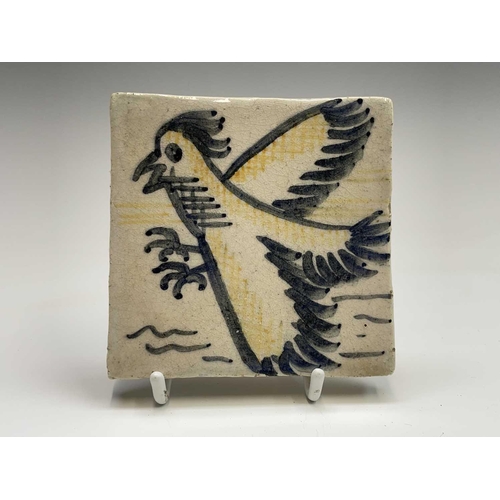 841 - A set of six studio pottery tiles, each hand painted with animal subjects, including a bird, a camel... 