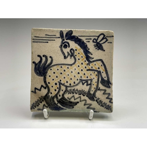 841 - A set of six studio pottery tiles, each hand painted with animal subjects, including a bird, a camel... 