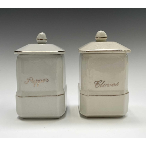 850 - A set of eleven early 20th century 'Empire Ware' kitchen storage jars, comprising five 19cm tall jar... 