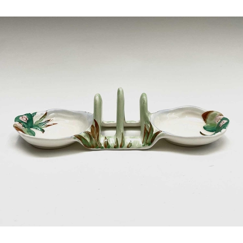 852 - A Clarice Cliff for Newport Pottery 'Water Lily' toast rack, width 20cm, and a Beswick Beatrix Potte... 