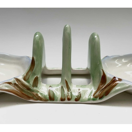 852 - A Clarice Cliff for Newport Pottery 'Water Lily' toast rack, width 20cm, and a Beswick Beatrix Potte... 