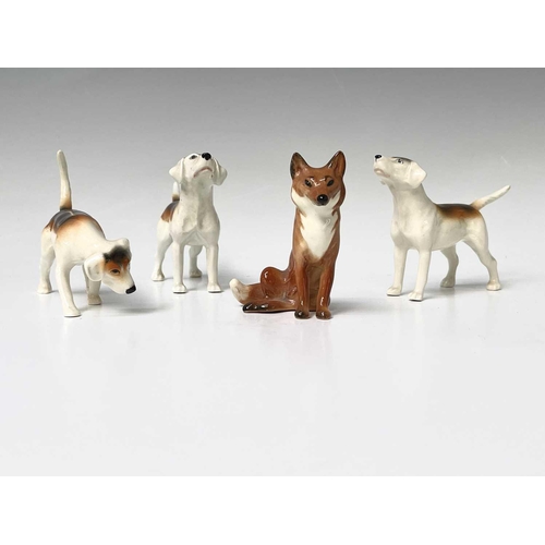 857 - Three Beswick foxhounds and a Beswick seated fox (4).