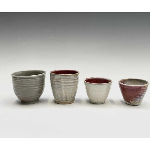 859 - Lynda Jewell, A collection of Pierrot pottery, to include cups, saucers, bowls and stands, impressed... 