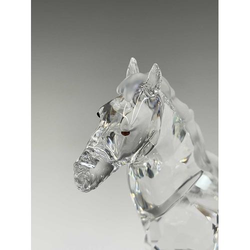 863 - Swarovski Crystal - a standing horse, height 13.5cm, a rearing horse, height 11cm, and a Swarovski C... 