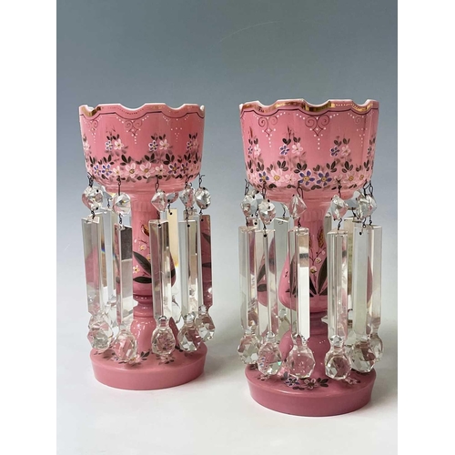 864 - A pair of Victorian pink opaque glass lustre vases, with floral enamel and gilt painted decoration, ... 