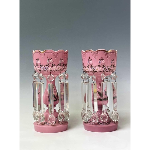 864 - A pair of Victorian pink opaque glass lustre vases, with floral enamel and gilt painted decoration, ... 