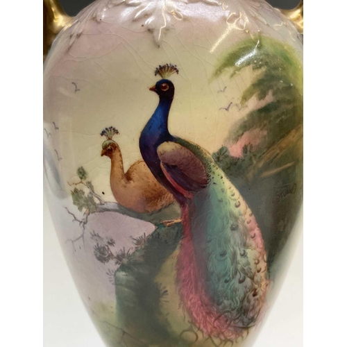 867 - A pair of Fielding & Co Crown Devon vases and covers, one with coloured decoration of pheasants, sig... 