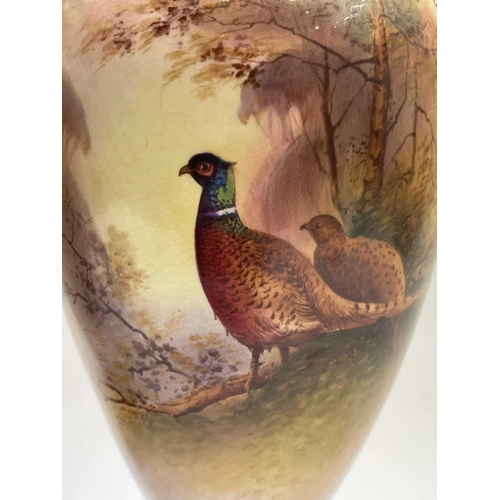 867 - A pair of Fielding & Co Crown Devon vases and covers, one with coloured decoration of pheasants, sig... 