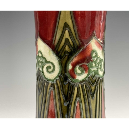 874 - A Minton Secessionist vase with tube lined decoration, printed mark 'Minton Ltd No. 1' to base. Heig... 