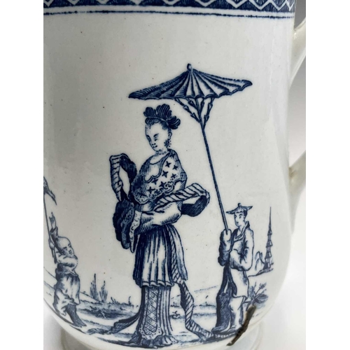 876 - An 18th century blue and white bell form mug, possibly Liverpool, printed to one side with an Orient... 