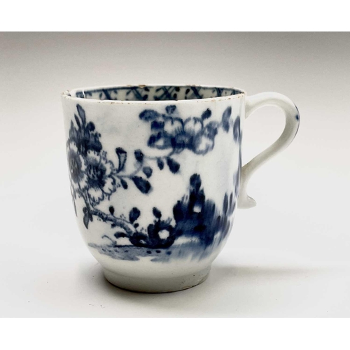 880 - A Lowestoft blue and white porcelain coffee cup, circa 1780, painted with a rock, flowering peony an... 