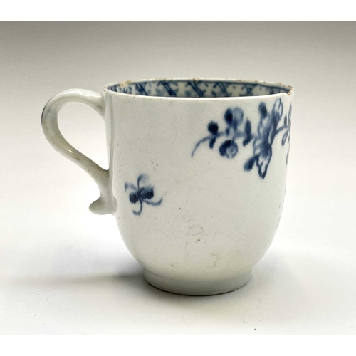 880 - A Lowestoft blue and white porcelain coffee cup, circa 1780, painted with a rock, flowering peony an... 