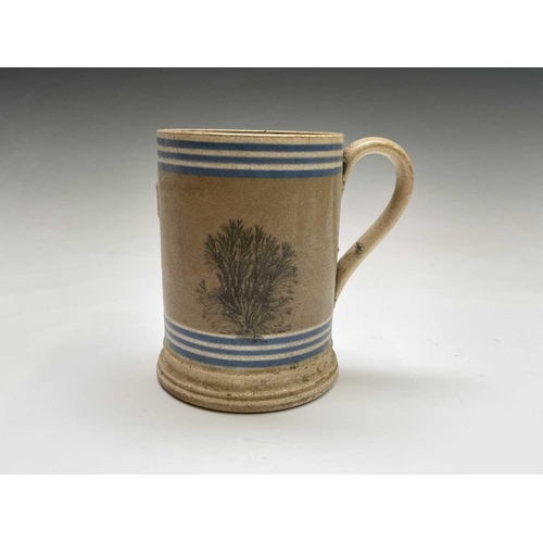 883 - A Victorian mocha ware pint mug, with applied Imperial label, height 12.5cm, together with a silver ... 