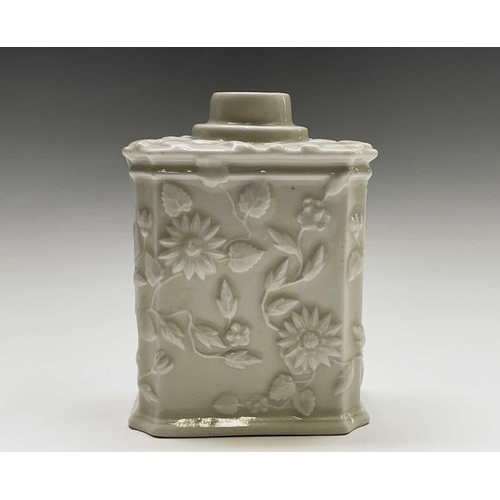 891 - A Continental white porcelain tea caddy, 19th century, moulded with flowers and foliage, height 11cm... 