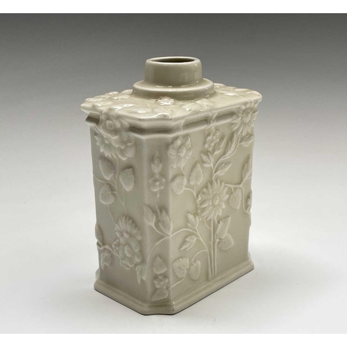 891 - A Continental white porcelain tea caddy, 19th century, moulded with flowers and foliage, height 11cm... 