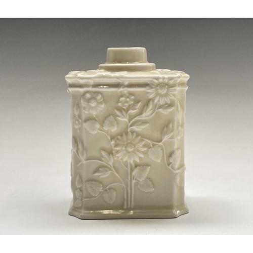 891 - A Continental white porcelain tea caddy, 19th century, moulded with flowers and foliage, height 11cm... 