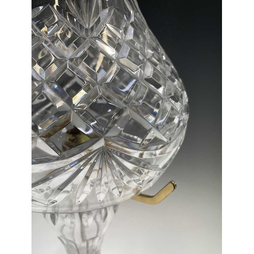 892 - A Waterford crystal cut glass table lamp and shade, supported on three brass arms and baluster stem,... 