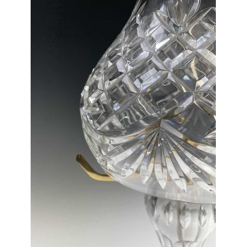 892 - A Waterford crystal cut glass table lamp and shade, supported on three brass arms and baluster stem,... 