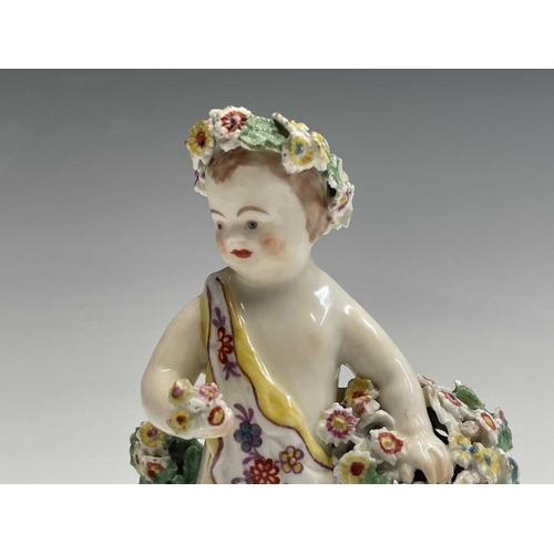 894 - A late 18th century Derby porcelain figure of a cherub with floral encrusted decoration, height 13.5... 