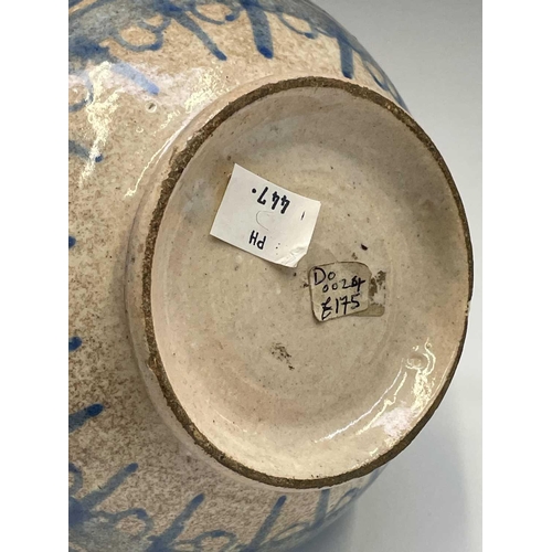 895 - A Continental tin glazed pottery strainer bowl, perhaps Spanish, 17th/18th century, with simple scro... 