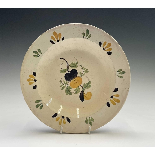 896 - A Greek earthenware plate, 19th century, painted in ochre, green and blue with a bird and flowers, t... 