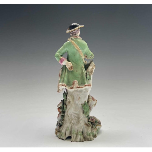 903 - A Chelsea porcelain figure of a sportsman, circa 1760, with a dog at his feet, height 21.5cm, togeth... 