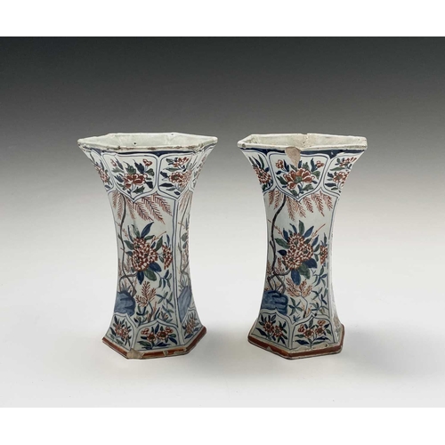 904 - A pair of Dutch Delft polychrome vases, 18th century, of hexagonal tapered form, painted in the Chin... 