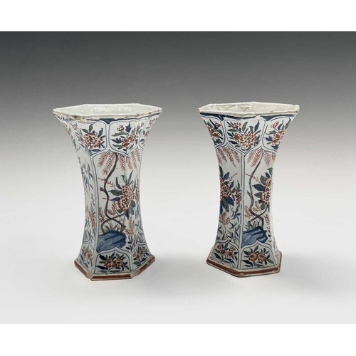 904 - A pair of Dutch Delft polychrome vases, 18th century, of hexagonal tapered form, painted in the Chin... 