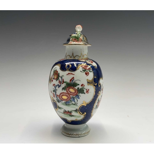 906 - A Worcester tea caddy and a cover, circa 1770, the blue scale ground with panels of Japan flowers, b... 