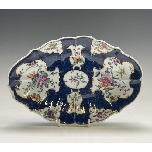 907 - A Worcester porcelain dish, circa 1770, the blue scale ground with floral reserves, blue seal mark, ... 