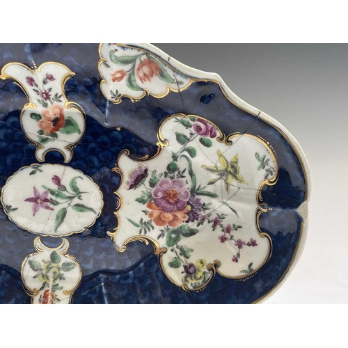 907 - A Worcester porcelain dish, circa 1770, the blue scale ground with floral reserves, blue seal mark, ... 