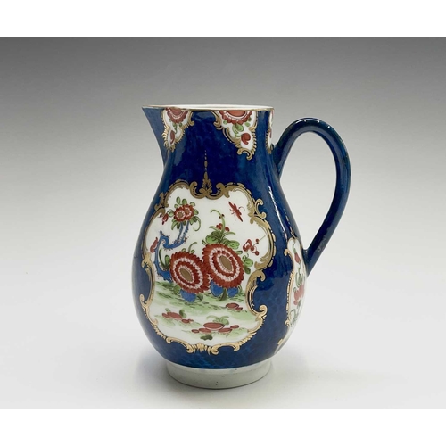 908 - A Worcester jug, circa 1770, the blue scale ground decorated with gilt edged floral panels, crescent... 