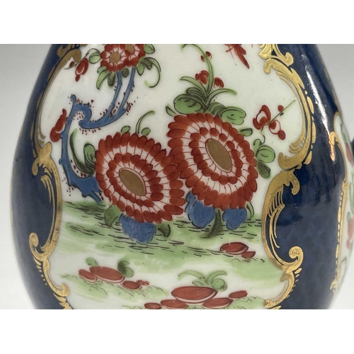 908 - A Worcester jug, circa 1770, the blue scale ground decorated with gilt edged floral panels, crescent... 